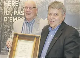  ?? Lynn CUrwin/TC Media ?? Bob Taylor presented Truro Mayor Bill Mills with the Colchester Historical Society Heritage Award. The town was given the award for the work done to create a library in the former Normal College.