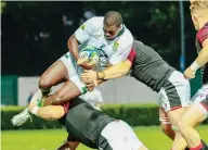  ?? ?? Held: Lukhanyo Vokozela stopped by Wales defence