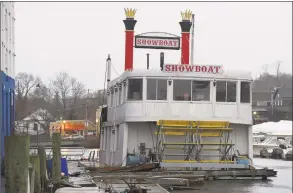  ?? Tyler Sizemore / Hearst Connecticu­t Media ?? The party boat “Showboat” is docked and prepared to be moved overseas on a cargo ship from Port Chester, N.Y., on Nov. 26. The 110-foot paddle wheel steam boat, once known as the “Mark Twain,” was well-known for hosting parties and dockside gatherings at the former Showboat Hotel, now the Delamar.