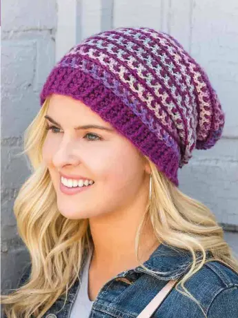  ??  ?? One easy pattern, three simple-to-crochet textured stitches and your choice of a variegated and coordinati­ng solid-colored yarn make this pattern one you’ll make many times this winter!