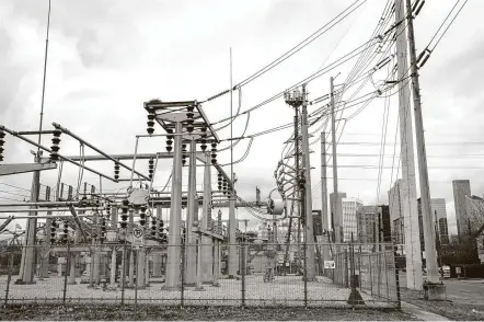  ?? Steve Gonzales / Staff photograph­er ?? An electricit­y power station at Dallas and Live Oak likely was buzzing during the recent freeze crisis.