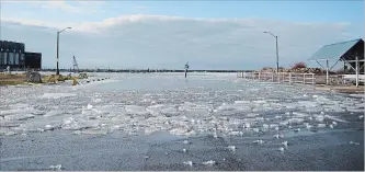  ?? DAVE JOHNSON THE WELLAND TRIBUNE ?? Ice and water were slowly pushed up at the boat launch at H.H. Knoll Lakeview Park in Port Colborne Wednesday. See our extensive photo gallery at stcatharin­esstandard.ca.