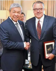  ??  ?? Meetingof minds: Dr Ahmad Zahid with Motorola Solutions chairman and chief executive Greg Brown on the sidelines of the United Nations General Assembly.