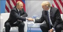  ?? THE NEW YORK TIMES ?? Presidents Vladimir Putin and Donald Trump greet each other at the G20 conference in Hamburg, Germany, on July 7.
