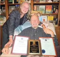  ?? COURTESY OF SAYA NOVINGER ?? George Novinger displays his Kiwanis Legion of Honor certificat­es and Distinguis­hed Service Award plaque with Kiwanis Club of Tehachapi President Tina Cunningham.