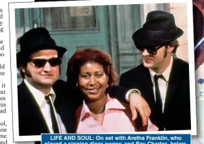  ?? ?? LIFE AND SOUL: On set with Aretha Franklin, who played a singing diner owner; and Ray Charles, below, whose rendition of Shake A Tail Feather is a highlight