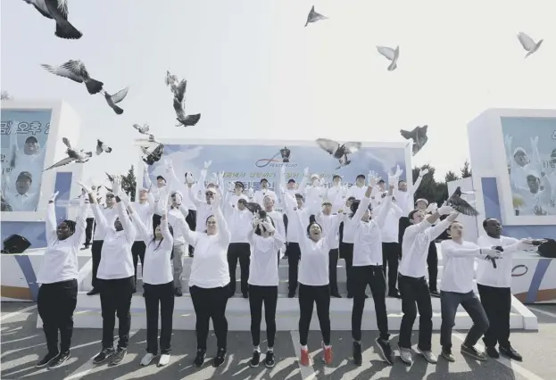  ?? PICTURE: AHN YOUNG-JOON/AP ?? Members of Unificatio­n Church release pigeons in a prayer for peace during a Peace Road event to celebrate upcoming a summit