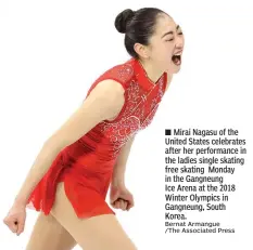  ?? Bernat Armangue /The Associated Press ?? ■ Mirai Nagasu of the United States celebrates after her performanc­e in the ladies single skating free skating Monday in the Gangneung
Ice Arena at the 2018 Winter Olympics in Gangneung, South Korea.