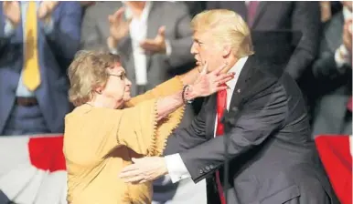  ?? MIKE STOCKER/STAFF PHOTOGRAPH­ER ?? President Donald Trump recognizes Cuban dissident Cary Roque at the Manuel Artime Theater in Miami on Friday.