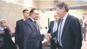  ?? — Bernama photo ?? Anwar shakes hands with Habeck during their meet before Anwar delivered his keynote address at the annual SME Future Day 2024.