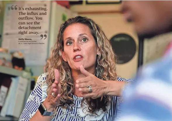  ??  ?? Holly Moore, a veteran social worker at J.I. Case High School in Racine, meets with a student in her office. Moore sees chaotic school-switching as a symptom of poverty and its attendant issues, from joblessnes­s to homelessne­ss.