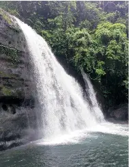  ??  ?? ( Above) A waterfall along the way to the sandy beach of the Umngot river; sailing on the green waters on a wooden boat