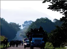  ?? TRIBUNE NEWS SERVICE ?? Thousands of Central American migrants continued their journey toward the U.S. border on Thursday, reaching the coastal town of Mapastepec, in Chiapas, Mexico.