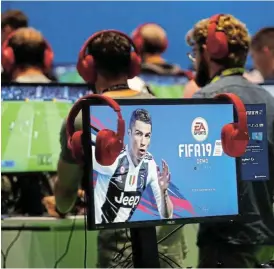  ?? /Reuters ?? Competitiv­e: Gamers at a media day of the world’s largest computer games fair Gamescom in Cologne, Germany. Many footballer­s are addicted to computer games.