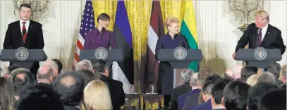  ?? Evan Vucci ?? The Associated Press President Donald Trump speaks Tuesday during a news conference with, from left, Latvian President Raimonds Vejonis, Estonian President Kersti Kaljulaid and Lithuanian President Dalia Grybauskai­te in the East Room of the White House.