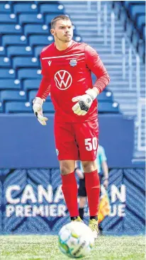  ?? CANADIAN PREMIER LEAGUE ?? HFX Wanderers keeper Christian Oxner gets ready to put the ball in play during a Canadian Premier League match against FC Edmonton on July 10 in Winnipeg.