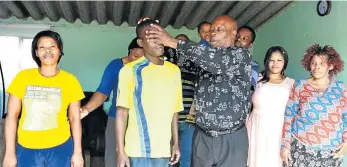  ?? Picture: TK MTIKI ?? HEALING HANDS: Nemato pastor Mxolisi Silungu has been preaching in his own home for ten years, but since his congregati­on has grown, he constructe­d a tent-like shack structure in his yard to accommodat­e the community. He has recently been allocated a...