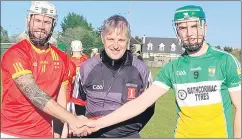  ?? ?? Fionn O’Neill Mallow captain, Willie Wallis referee and Bride Rovers captain Paddy O’Flynn prior to the throw-in.