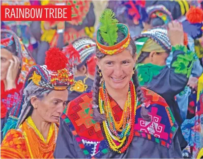  ?? Picture: AFP ?? Kalash women in Pakistan wearing traditiona­l dresses arrive to take part in the Chilam Joshi festival celebratin­g the arrival of spring at Bumburet village yesterday.