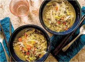  ?? CHEYENNE M. COHEN AP PHOTOS ?? One-skillet cheesy beefy macaroni (top) and chicken ramen noodle soup (above). Home cooking trends include simpler recipes, one-pot meals, sheet-pan meals and finger food.