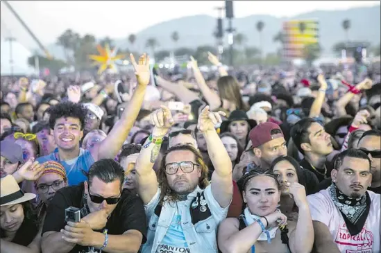  ?? Kent Nishimura Los Angeles Times ?? FANS OF rapper Vince Staples pack his set on the first weekend of the Coachella festival in Indio. The second weekend saw Kanye West give a soulful Sunday Service.