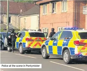  ??  ?? Police at the scene in Pontymiste­r
