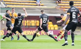  ??  ?? STAR TURN David Turnbull blasts in opener despite Livi attempts to block him