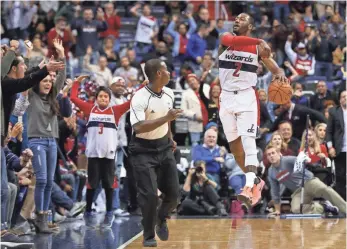  ?? GEOFF BURKE, USA TODAY SPORTS ?? “He’s not rushing to make a great play,” Wizards coach Scott Brooks says of John Wall, above. “He’s letting his play become great with his patience.”