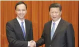  ??  ?? Chinese President Xi Jinping shakes hands with Eric Chu ( left), chairman of Taiwan's ruling Kuomintang ( KMT) party, during Mr Chu’s visit to the Great Hall of the People in Beijing on Monday.