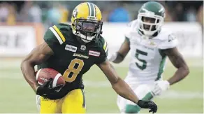  ?? DAVID BLOOM ?? Eskimos receiver Kenny Stafford runs by the Roughrider­s’ Crezdon Butler Thursday night at Commonweal­th Stadium.