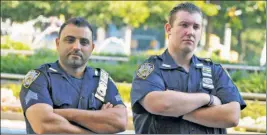  ??  ?? IT’S A STICK-UP! Sgt. Hameed Armani (left) and Officer Peter Cybulski got the middle finger from a man in Times Square who claims it’s free speech.