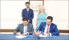  ??  ?? HE Dr Ali bin Fetais al-Marri signing a co-operation agreement with a US counterpar­t.