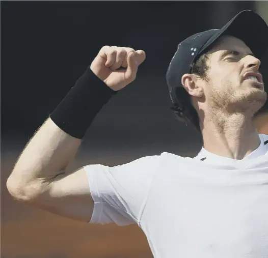  ??  ?? 0 Andy Murray punches the air after his hard- fought 6- 7, 6- 2, 6- 2, 7- 6 win over Martin Klizan in the second round of the French Open, with the Scot now due to face Juan Martin del Potro who has been struggling with his fitness in Paris.