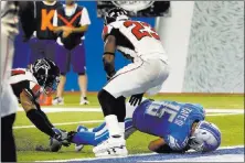  ?? Paul Sancya ?? Detroit Lions wide receiver Golden
Tate falls into the end zone for a
1-yard touchdown reception during the second half against the Atlanta Falcons on Sunday in Detroit. After a review, Tate was ruled down before reaching the end zone, a 10-second...