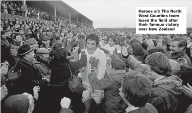  ??  ?? Heroes all: The North West Counties team leave the field after their famous victory over New Zealand