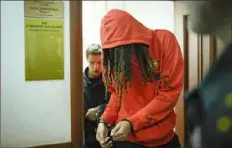  ?? Alexander Zemlianich­enko/Associated Press ?? WNBA star and two-time Olympic gold medalist Brittney Griner leaves a courtroom Friday after a hearing in Khimki, just outside of Moscow.