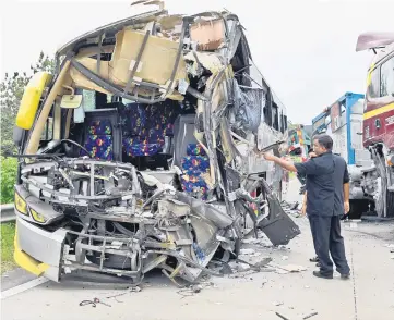  ??  ?? The condition of the express bus after the accident. — Bernama photo