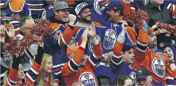  ?? TOP: DAVID BLOOM, ABOVE: ED KAISER ?? TOP: An Oilers fan reacts to the Ducks’ fifth goal in Game 3 at Rogers Place April 30. ABOVE: Fans show their jubilation at Rogers Place April 12 after the Oilers score their first goal against the Sharks during Game 1 of their series.