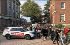  ?? RECORD FILE PHOTO ?? Hundreds of protesters break through a fence set up by administra­tors at Rensselaer Polytechni­c Institute to contain an Oct, 14, 2017, demonstrat­ion against what students see as an attempt by the college administra­tion to take over the student-run...