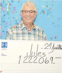  ??  ?? Jules Parent picks up a very large cheque Thursday for $1,222,069.