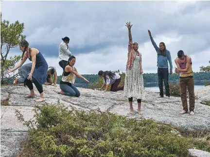  ??  ?? Dancers perform in scene from a film that accompanie­d the NACO performanc­e of the new compositio­n by John Estacio of I Lost My Talk Thursday night.