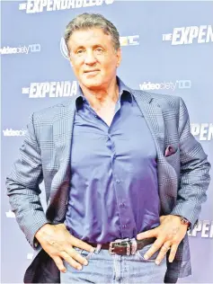  ??  ?? Stallone poses on the red carpet for the German premiere of ‘The Expendable­s 3’ on Aug 6, 2014. — Reuters file photo