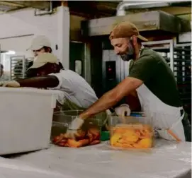  ?? JAMES JACKMAN/NEW YORK TIMES ?? Zak Stern, shown in his Miami bakery, asked customers to bring local mangoes in exchange for a bread loaf.