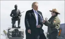  ?? Evan Vucci/Associated Press ?? Interpreti­ve park ranger Caitlin Kostic gives Republican presidenti­al nominee Donald Trump a tour at Gettysburg National Military Park on Saturday in Gettysburg.