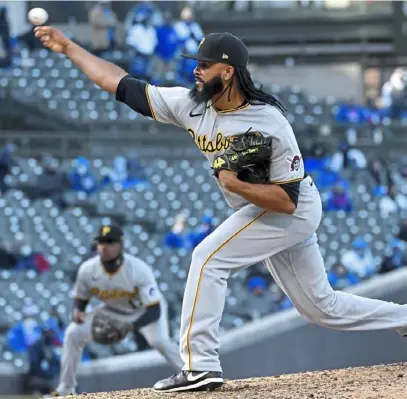  ?? Matt Freed/Post-Gazette ?? Richard Rodriguez earned a save with a scoreless ninth inning in the season-opening win April 1 against the Cubs at Wrigley Field.