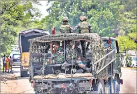  ??  ?? Army personnel on high alert after drones seen hovering over Ratnuchak-Kaluchak military station area, in Jammu on Monday.