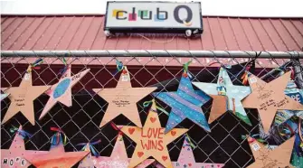  ?? David Zalubowski/Associated Press ?? Tributes hang on a fence outside of Club Q on Wednesday in Colorado Springs, Colo. Anderson Aldrich, 22, is accused of killing five people on Nov. 19 in a mass shooting at the gay nightclub.