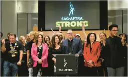  ?? ROBYN BECK/GETTY-AFP ?? SAG-AFTRA leaders Fran Drescher, center left, and Duncan Crabtree-Ireland, center right, update the media about the strike deal Nov. 10 in Los Angeles.