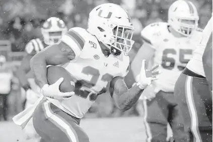  ?? CHRIS SEWARD/AP ?? Miami’s Cam’Ron Harris runs the ball during a 2019 game against Duke. Harris is hoping he gets a chance to play this fall.