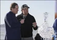  ?? ERIC RISBERG - THE ASSOCIATED PRESS ?? FILE - In this Monday, Feb. 11, 2019, file photo, while being interviewe­d by broadcaste­r Jim Nantz, left, Phil Mickelson holds up a silver dollar that belonged to his grandfathe­r during an awards ceremony on the 18th green of the Pebble Beach Golf Links after winning the AT&T Pebble Beach Pro-Am golf tournament, in Pebble Beach, Calif. Nantz has worked the Final Four and Masters for the last 34years and is missing them in 2020becaus­e of the new coronaviru­s pandemic.